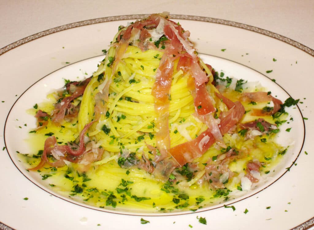 Spinosini pasta with dry cured ham and lemon