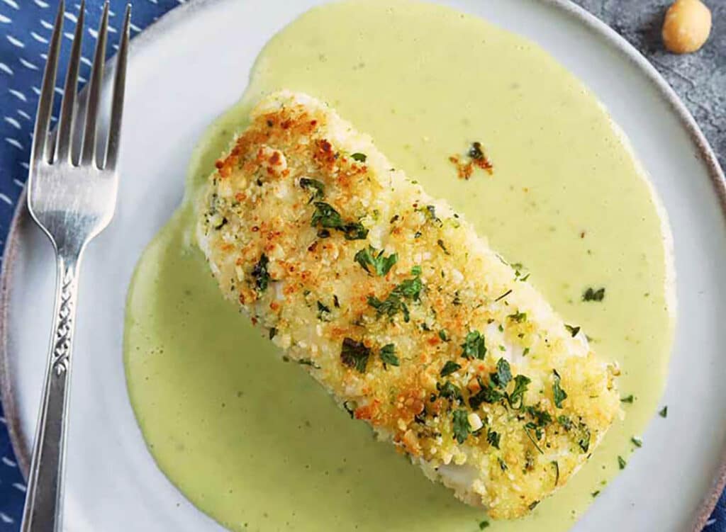 Macadamia nut crusted halibut with fresh herbs and coconut sauce